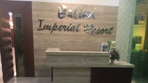 A reception desk with a sign that reads "Babian Imperial Resort." - Babian Imperial Resort (Lucknow)