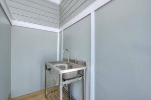 Shared utility sink fish station. - Fishy Fishy Up & Down 7 BR 3.5 BA beach home @ Yaupon OKI Pier & 801 Event Ctr! (Oak Island)