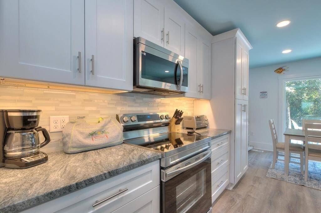 Stylish kitchen with modern finishes, quality appliances and lots of prep space 