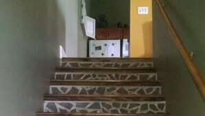 A staircase with patterned tiles and wooden steps. - Beautiful, remodeled penthouse in Lebanon Ohio, between Dayton and Cincinnati (Lebanon)