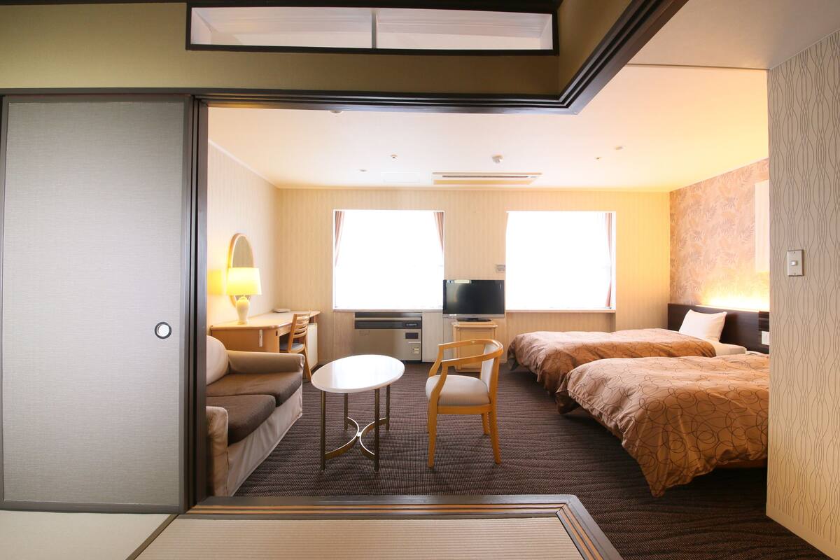 japanese/western style room for 4 people | in-room safe, desk, laptop workspace, cots/infant beds