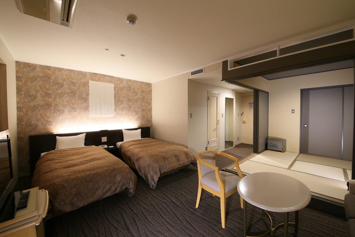 japanese/western style room for 4 people | in-room safe, desk, laptop workspace, cots/infant beds