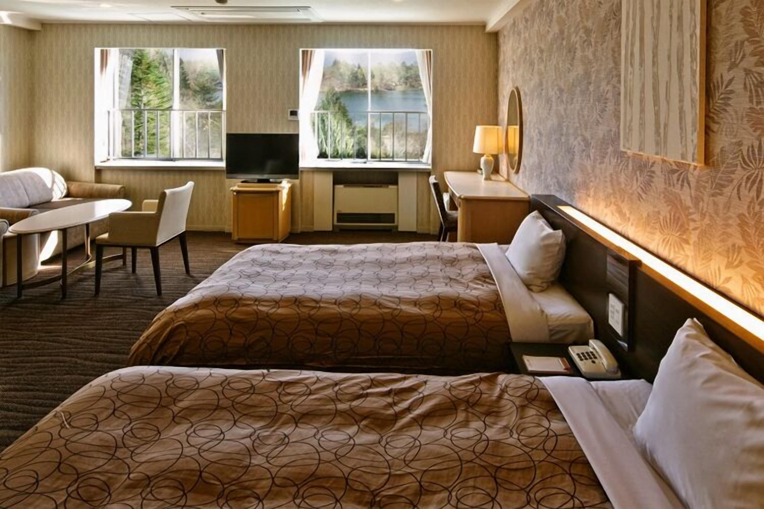 standard twin room | in-room safe, desk, laptop workspace, cots/infant beds