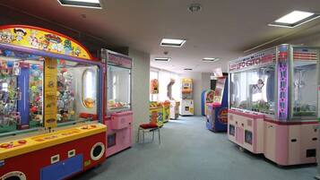 Enjoy games and entertainment in this lively arcade area featuring a variety of claw machines.