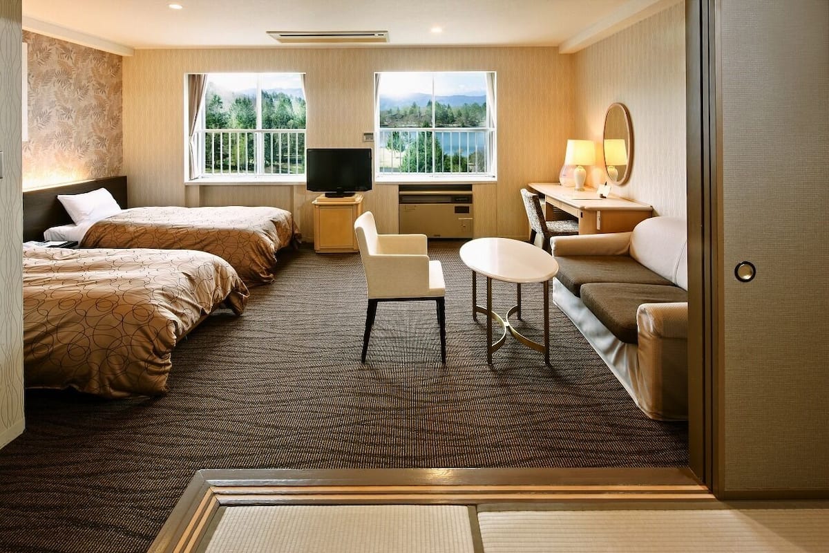 japanese/western style room for 4 people | in-room safe, desk, laptop workspace, cots/infant beds