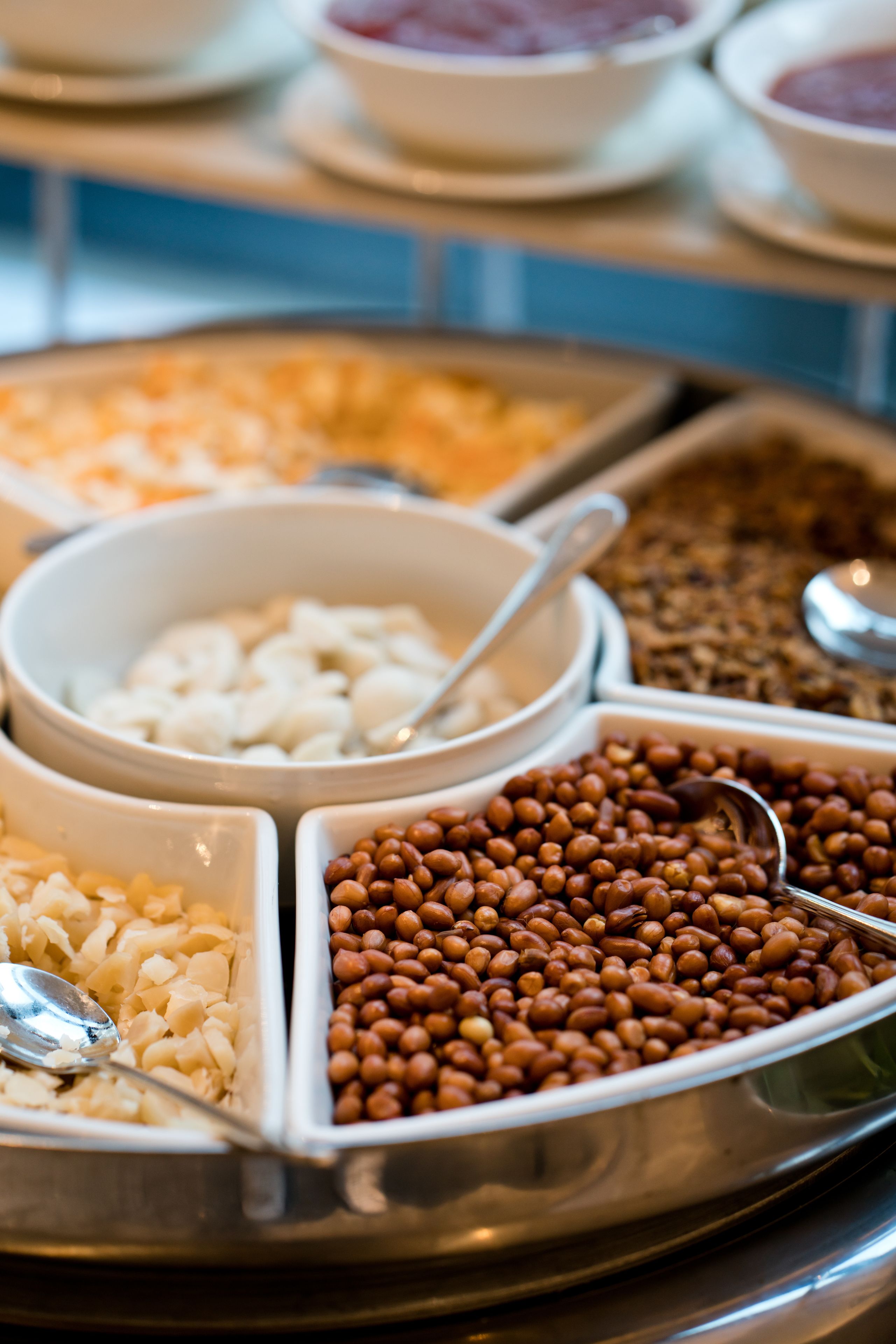 A buffet with various food items including beans, rice, and other dishes.