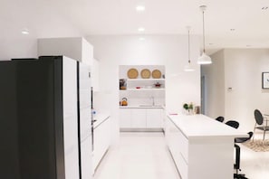 Apartment, 4 Bedrooms | Private kitchen | Coffee/tea maker, electric kettle