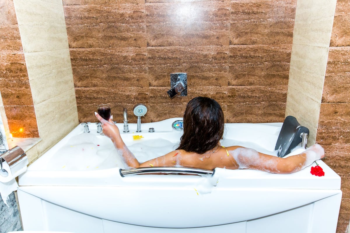 executive suite room | bathroom | designer toiletries, hair dryer, slippers, towels