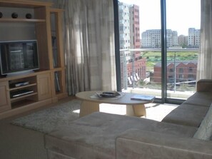 Apartment, 1 Bedroom (KB605W) | Living area | Flat-screen TV - Island Letting - (Self Catering) Knights Bridge Apartments (Cape Town)
