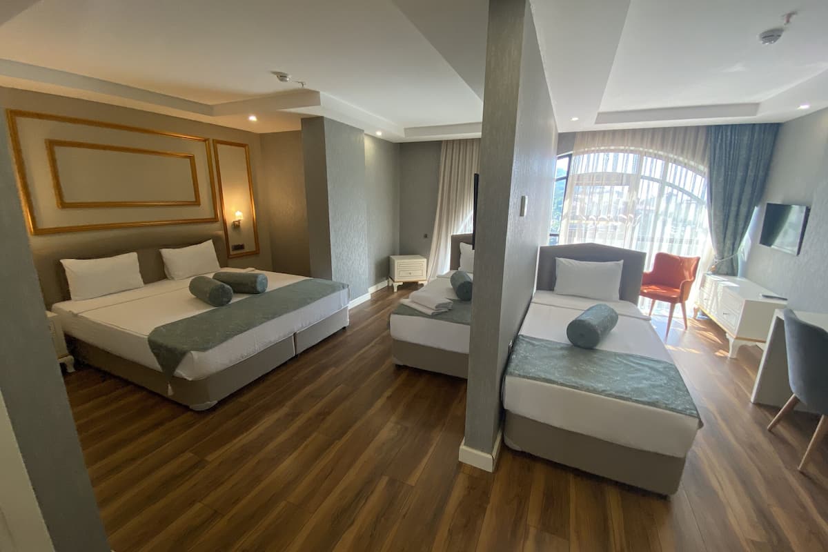 family room, multiple beds | premium bedding, minibar, in-room safe, blackout curtains