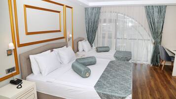 Deluxe Room | Premium bedding, minibar, in-room safe, blackout drapes
