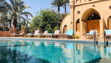 Outdoor pool, a natural pool, sun loungers