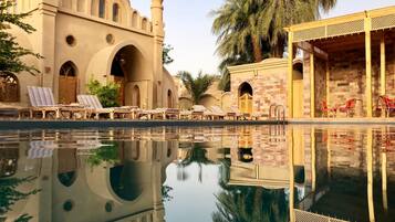 Outdoor pool, a natural pool, sun loungers