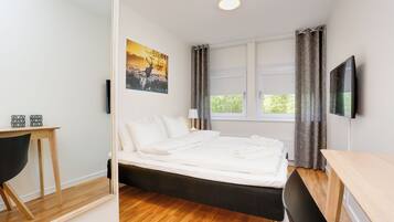 Desk, laptop workspace, blackout drapes, soundproofing