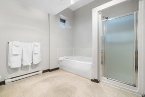 Superior Room, 1 King Bed, Jetted Tub | Bathroom | Combined shower/tub, hair dryer, towels, soap