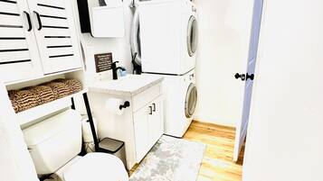 Shower, hair dryer, towels, toilet paper