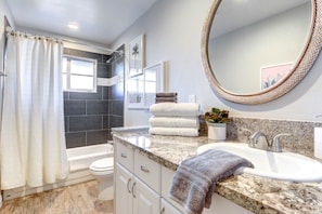Combined shower/tub, hair dryer, towels, shampoo