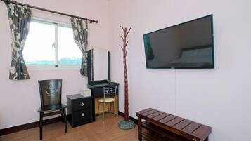 Standard Quadruple Room (Gardenia) | Living area | LCD TV