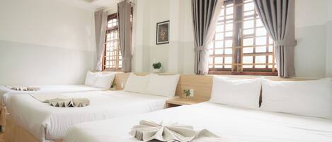 Family Room, Multiple Beds | Minibar, desk, soundproofing, free WiFi