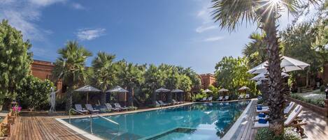 Outdoor pool, pool umbrellas, pool loungers