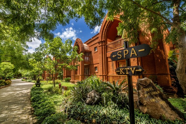 A brick building with a sign indicating a spa and a TV lounge. - Heritage Bagan Hotel (Nyaung-U)