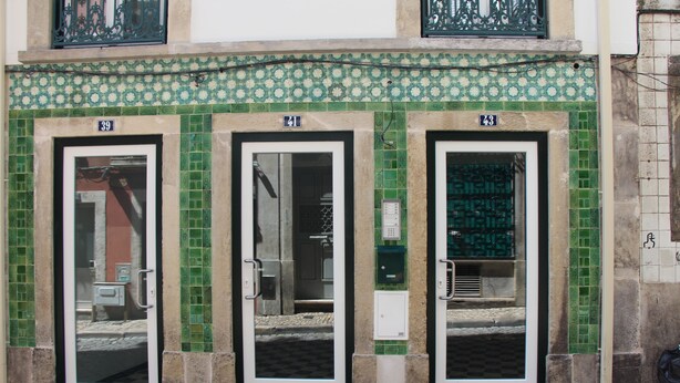 A building facade with three doors, each marked with a number. - DoBairro Suites at Bairro Alto (Lisbon)
