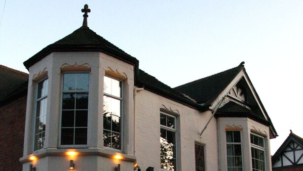 A two-story building with a corner turret and multiple windows. - Abbey Grange Hotel (Nuneaton)