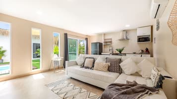 Premium Villa | Living area | 42-inch LCD TV with cable channels, TV, toys