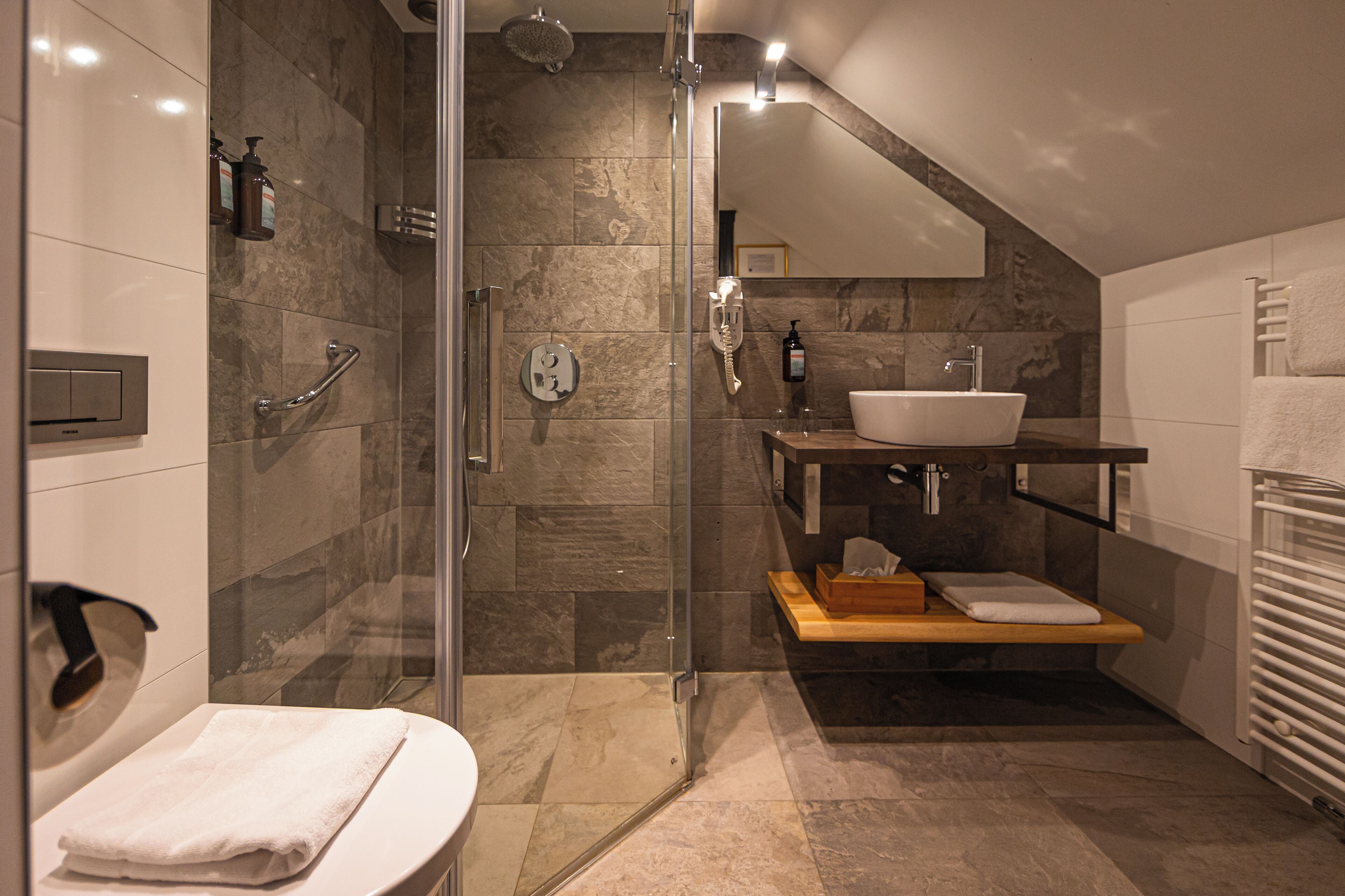 economy double room | bathroom | hair dryer, towels, soap, shampoo