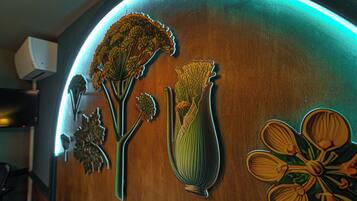 A wall with a wooden texture and decorative cut-out flowers.