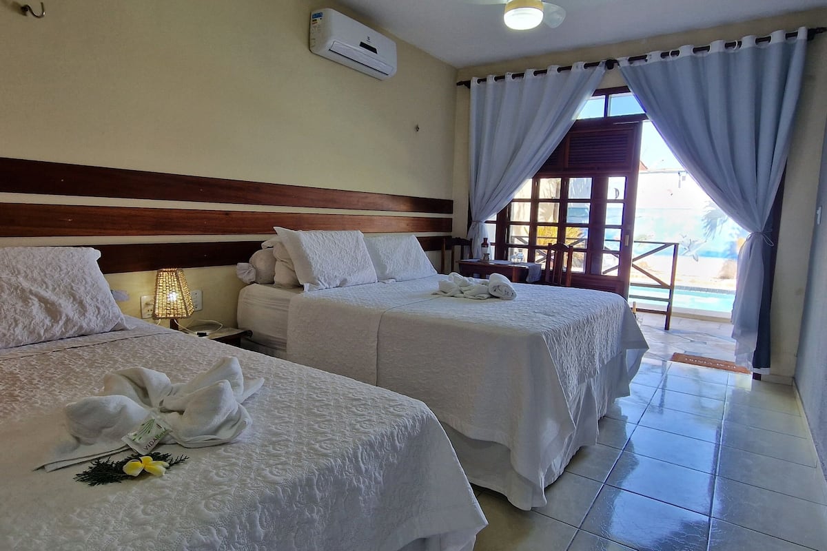 Deluxe Suite, 2 Bedrooms, Pool Access | Minibar, desk, free cribs/infant beds, rollaway beds