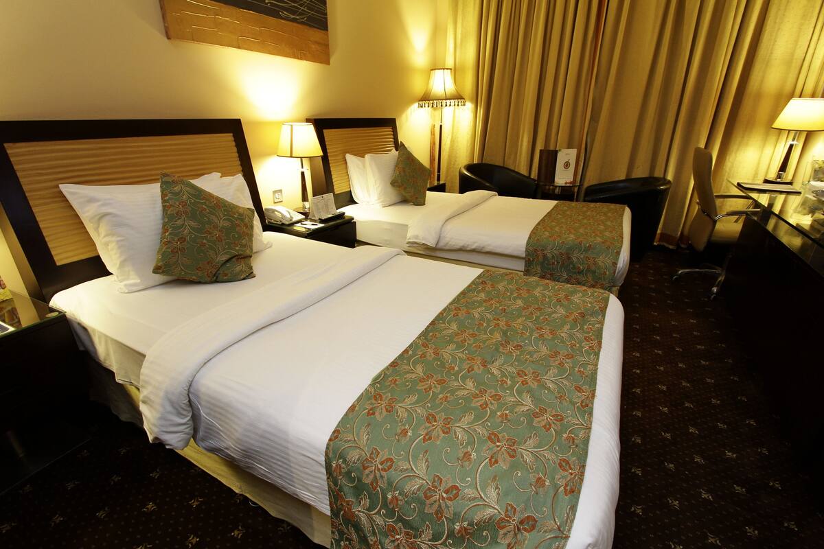 Twin Room | Minibar, in-room safe, blackout drapes, iron/ironing board (on request)