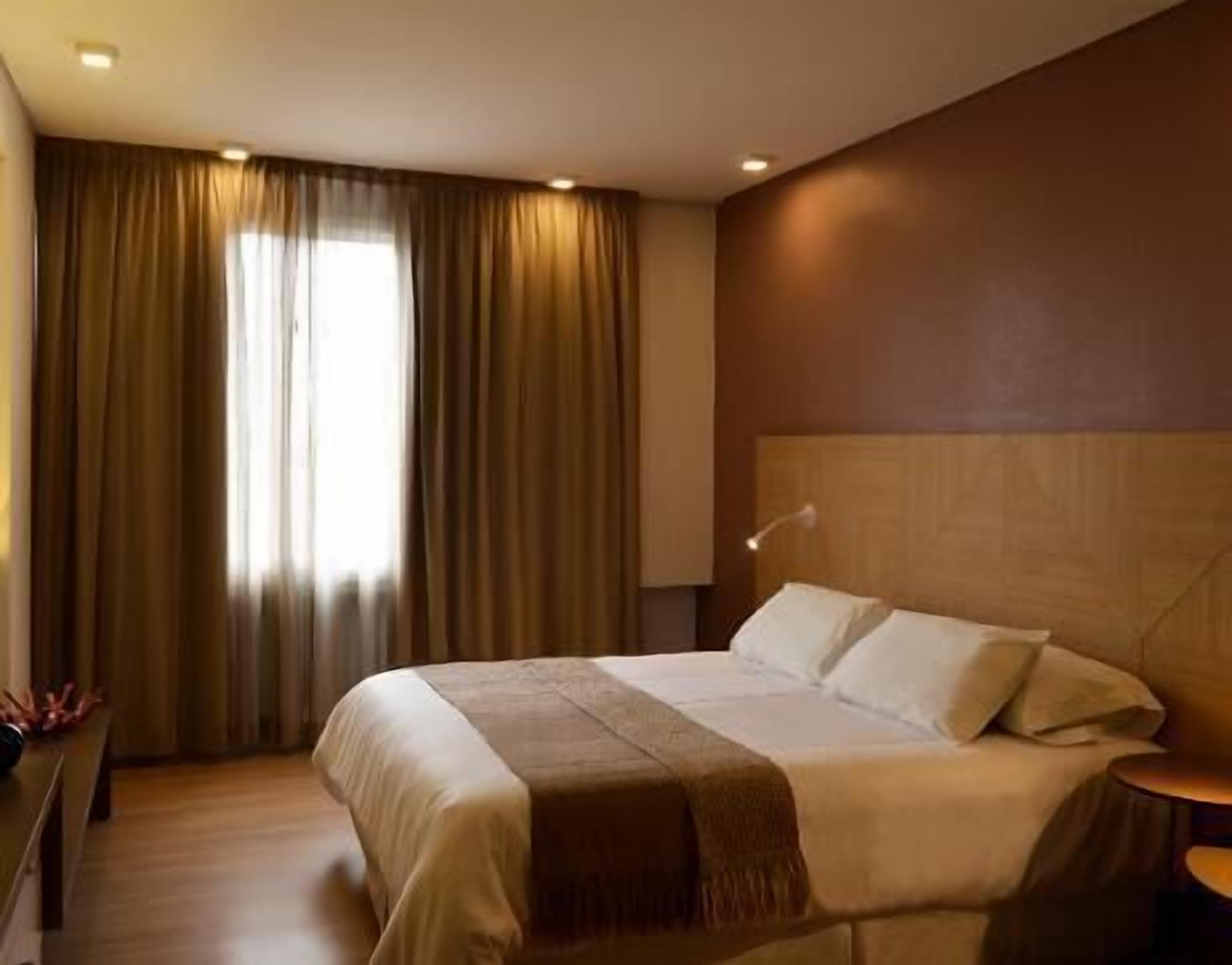 Premium bedding, down comforters, pillowtop beds, minibar