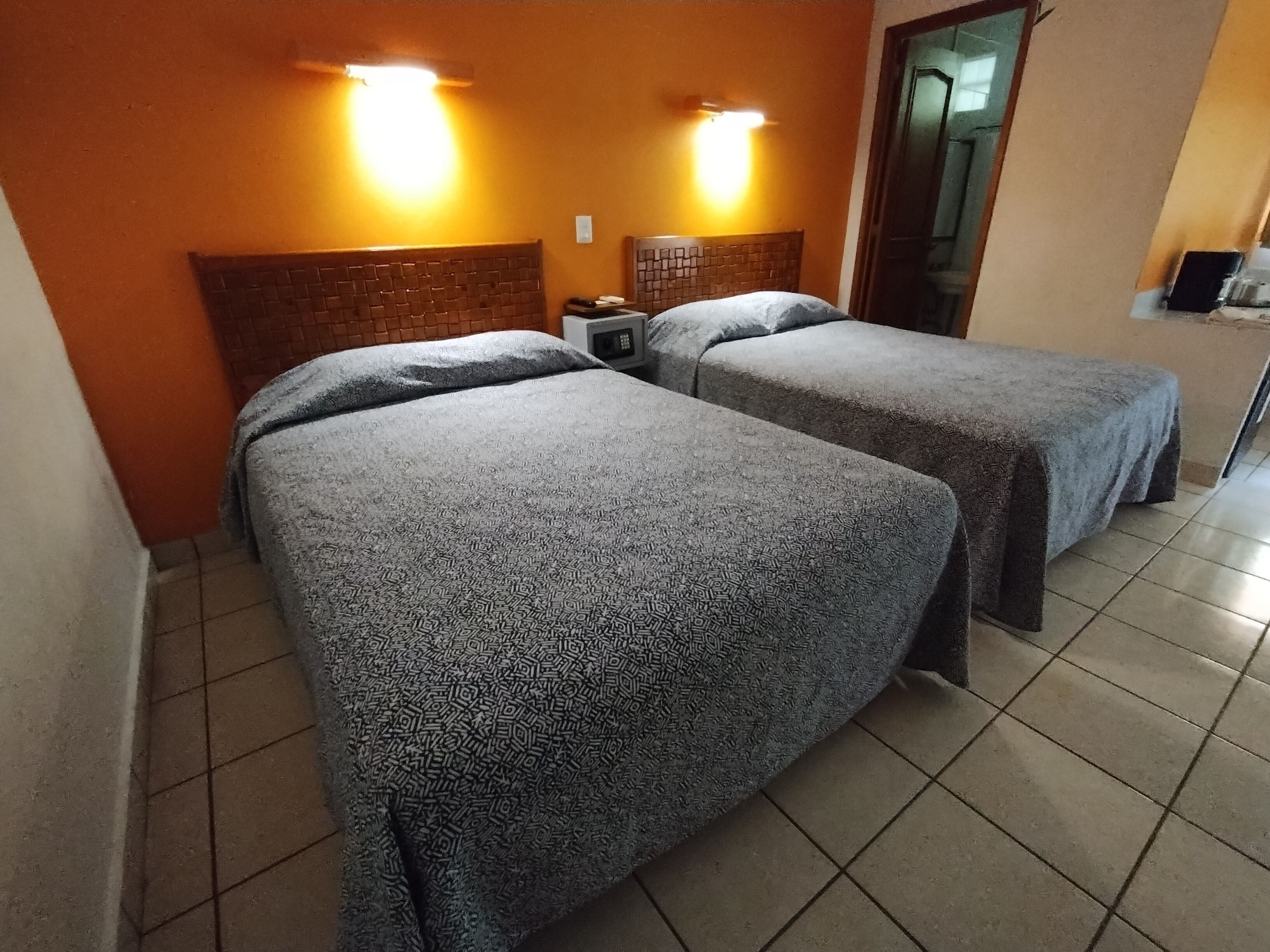 Standard Double Room, 2 Double Beds | Minibar, in-room safe, blackout drapes, iron/ironing board