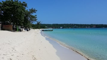 On the beach, sun loungers, beach towels