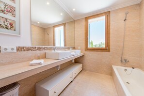 Bathtub, hair dryer, towels