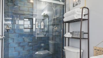 Combined shower/tub, hair dryer, towels, soap