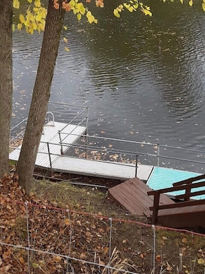 Relax on the lakeside dock with a bench and enjoy the serene surroundings.