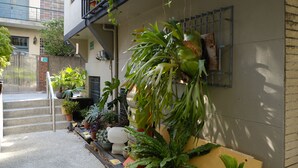 A residential building with a staircase leading to a balcony. - Adore Tainan - Adore Space (Tainan)