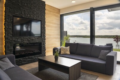 Dream house on the lake, private beach, sauna, fireplace, whirlpool tub, balcony, near Leipzig