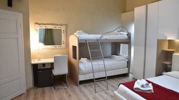 A bunk bed with a ladder, a desk with a chair, a mirror, and a red blanket on a bed.