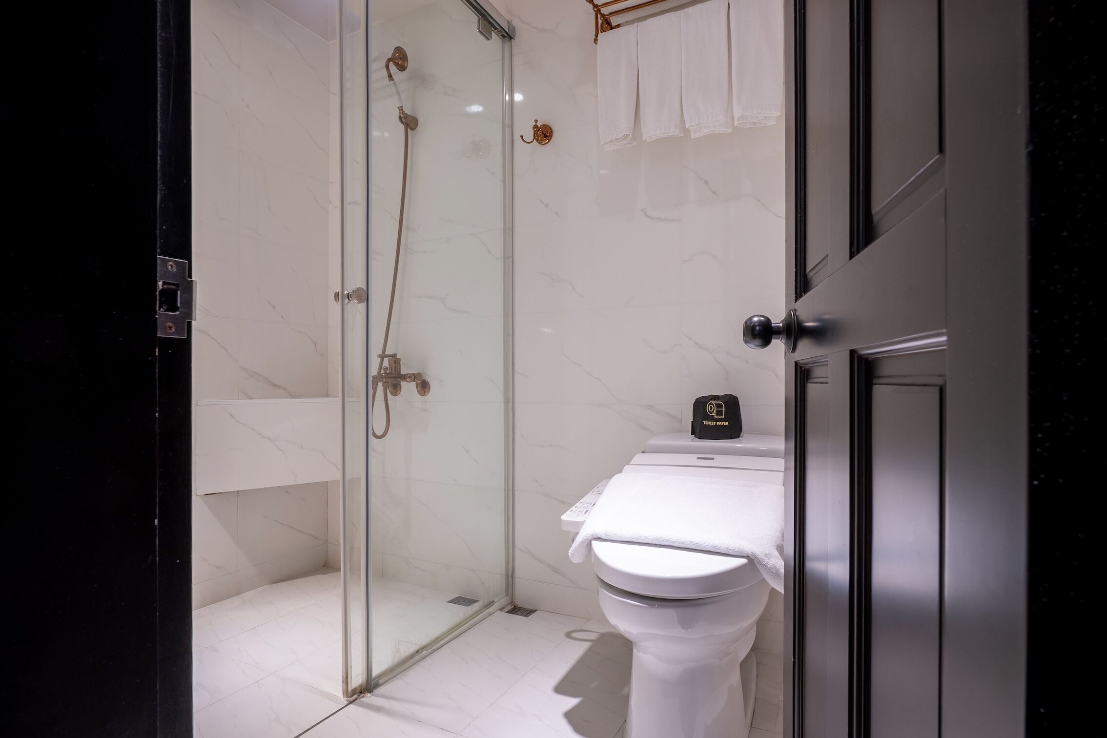 deluxe quadruple room | bathroom | shower, rainfall showerhead, hair dryer, towels