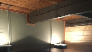A bedroom with a bed, pillows, a nightstand, and a wooden ceiling. - Charming 2 Bdrm Condo, Peaceful Setting on Bus Line/Vail #011008 (Vail)