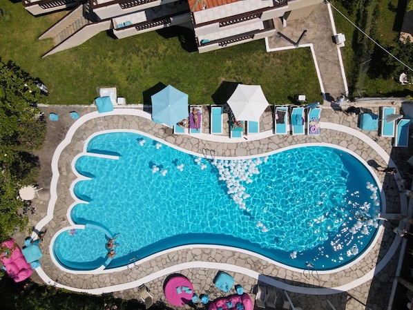 Outdoor pool, pool umbrellas, sun loungers