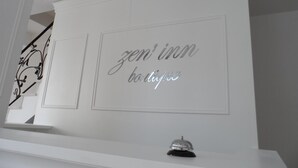 A wall with the text "zen inn boutique" in a stylized font. - Zen Inn Boutique (Sarkoy)