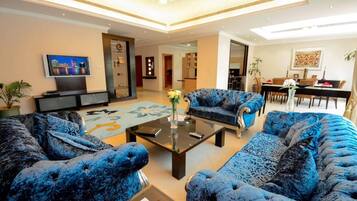 Family Villa, 4 Bedrooms, Garden View, Poolside | Living area | 32-inch TV with cable channels