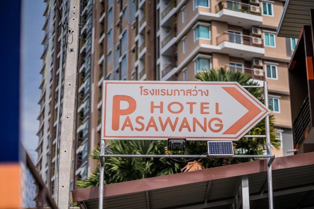 A directional sign for a hotel named PASAWANG.