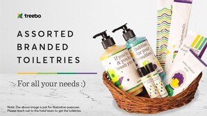 A basket of assorted branded toiletries including bottles and paper towels. - Treebo Amber International Mumbai Airport T2 (Mumbai)