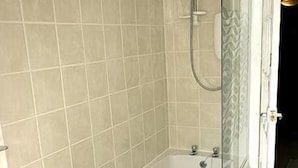 A bathroom with a bathtub, a shower, and a toilet. - The Manor Country House Hotel (Dumfries)