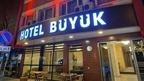 A hotel named HOTEL BUYUK with a modern facade, outdoor seating area, and multiple balconies. - Buyuk Hotel (Kayseri)